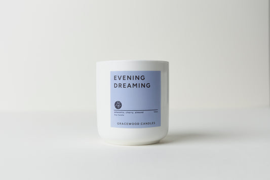 Candle labeled 'Evening Dreaming' on a white background