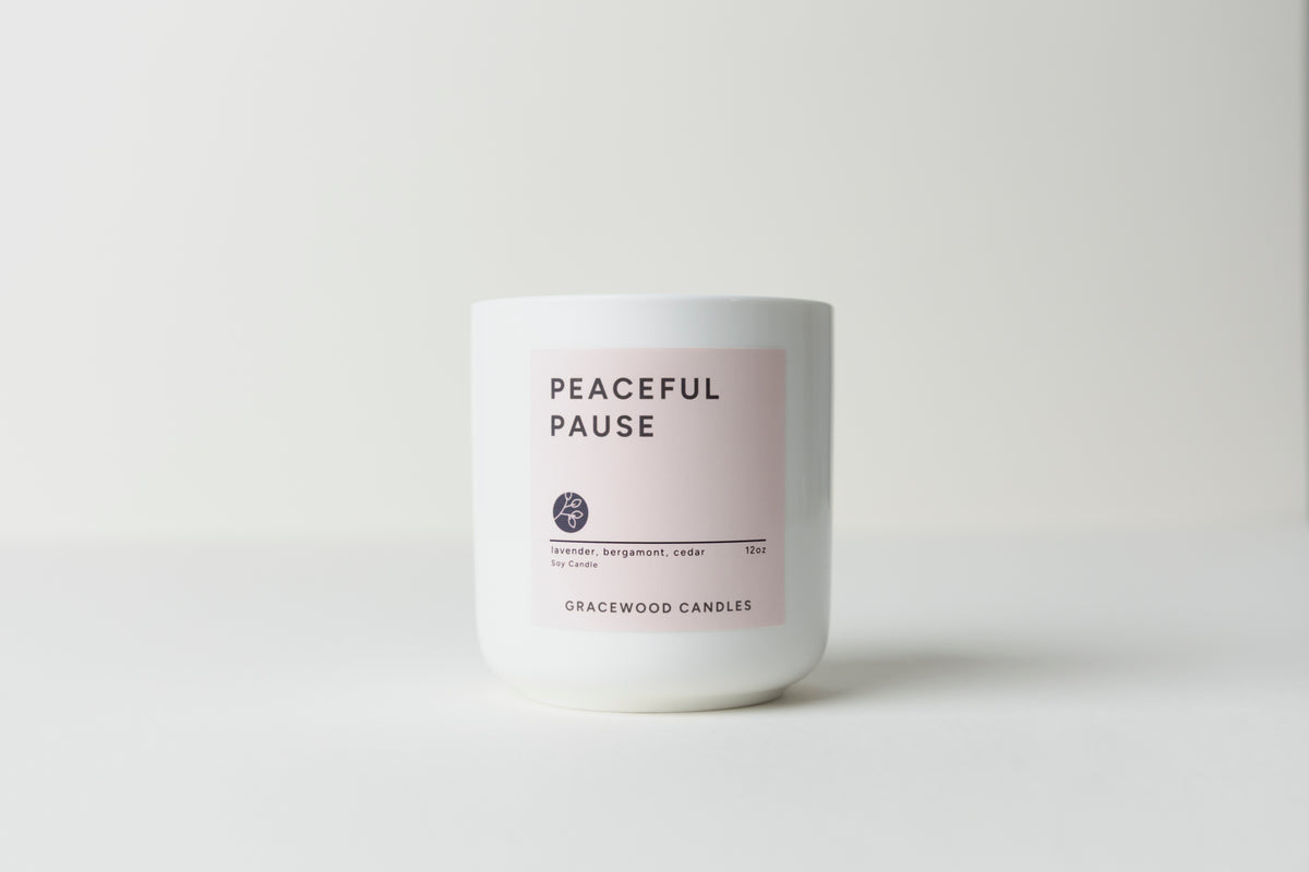 Candle labeled 'Peaceful Pause' by Gracewood Candles on a white background. 